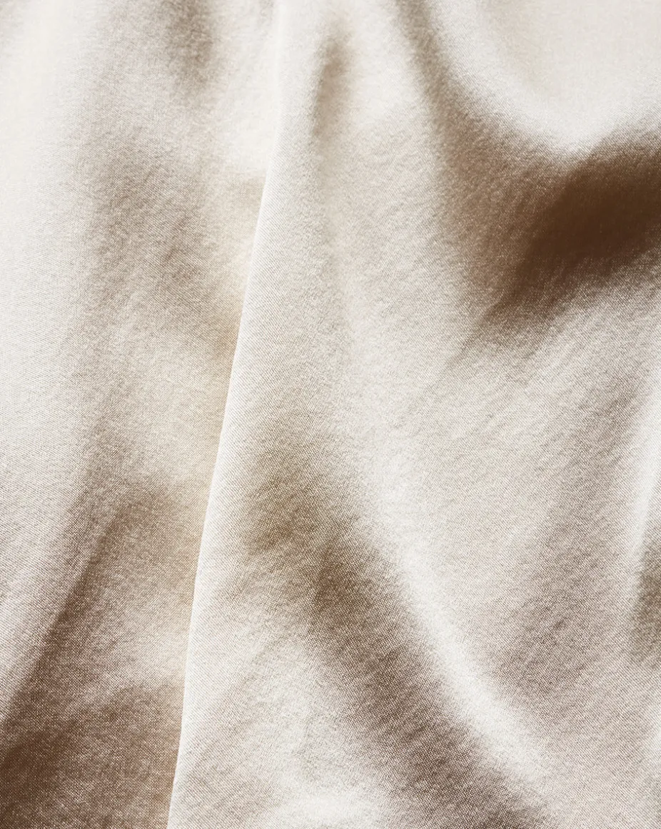 Fernanda Silk Bodysuit in Ivory x Poppy Delevingne